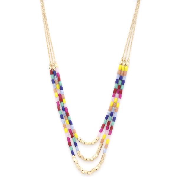 MULTI STRAND BEADED LAYERED NECKLACE