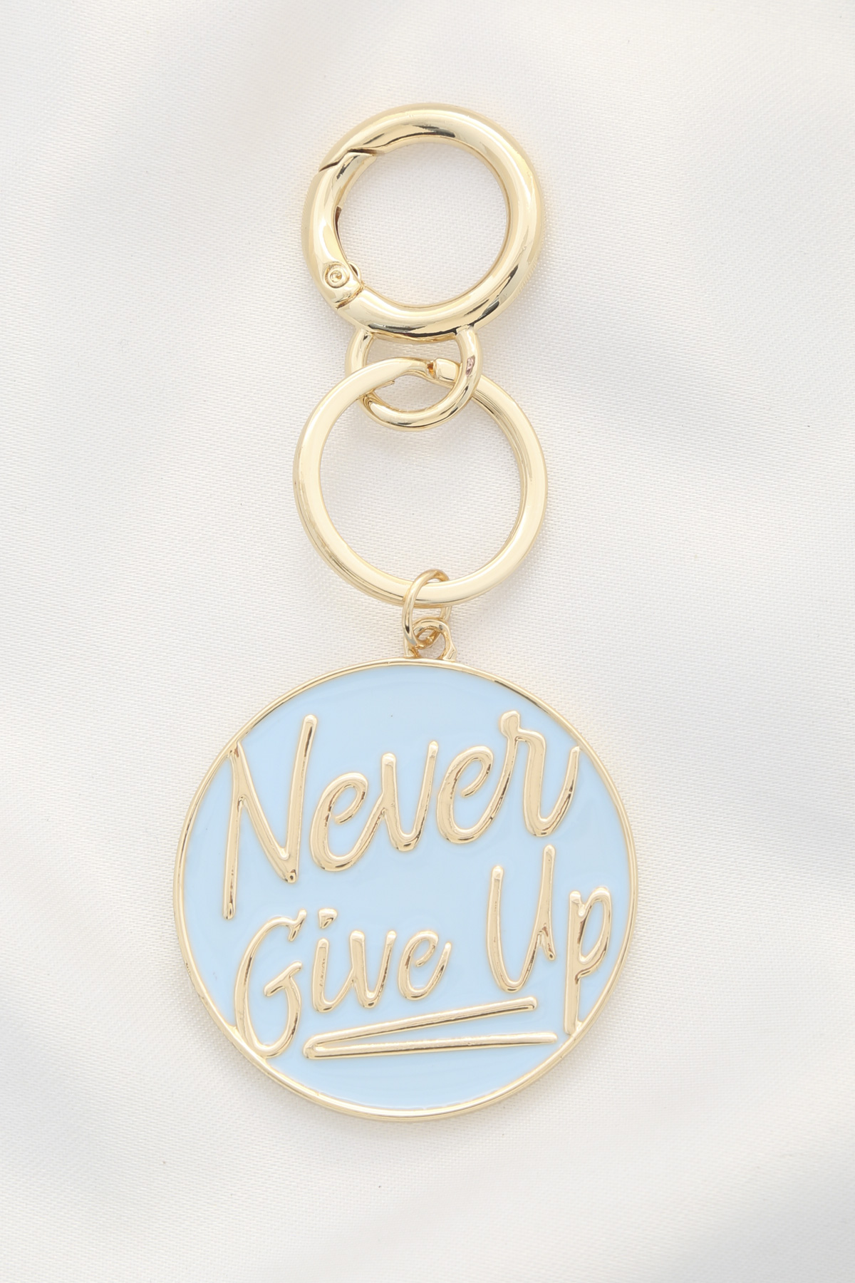 ROUND NEVER GIVE UP KEYCHAIN