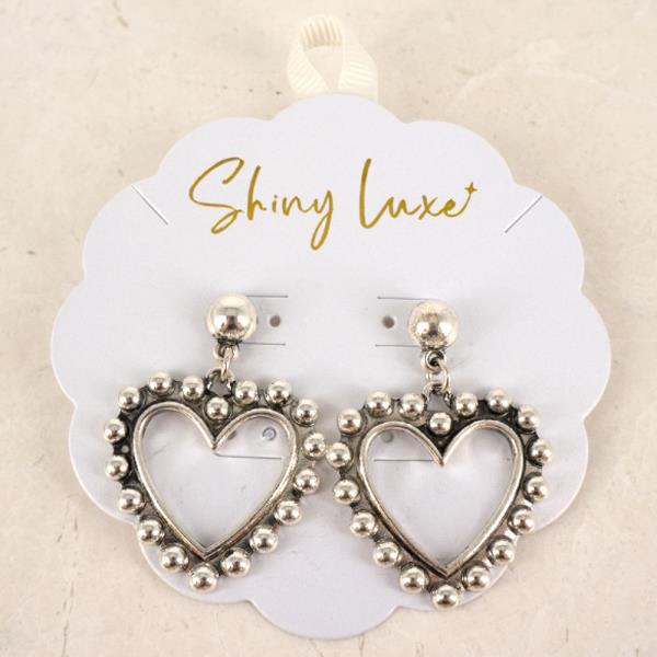 TEXTURED METAL HEART FRAME DANGLE EARRINGS
